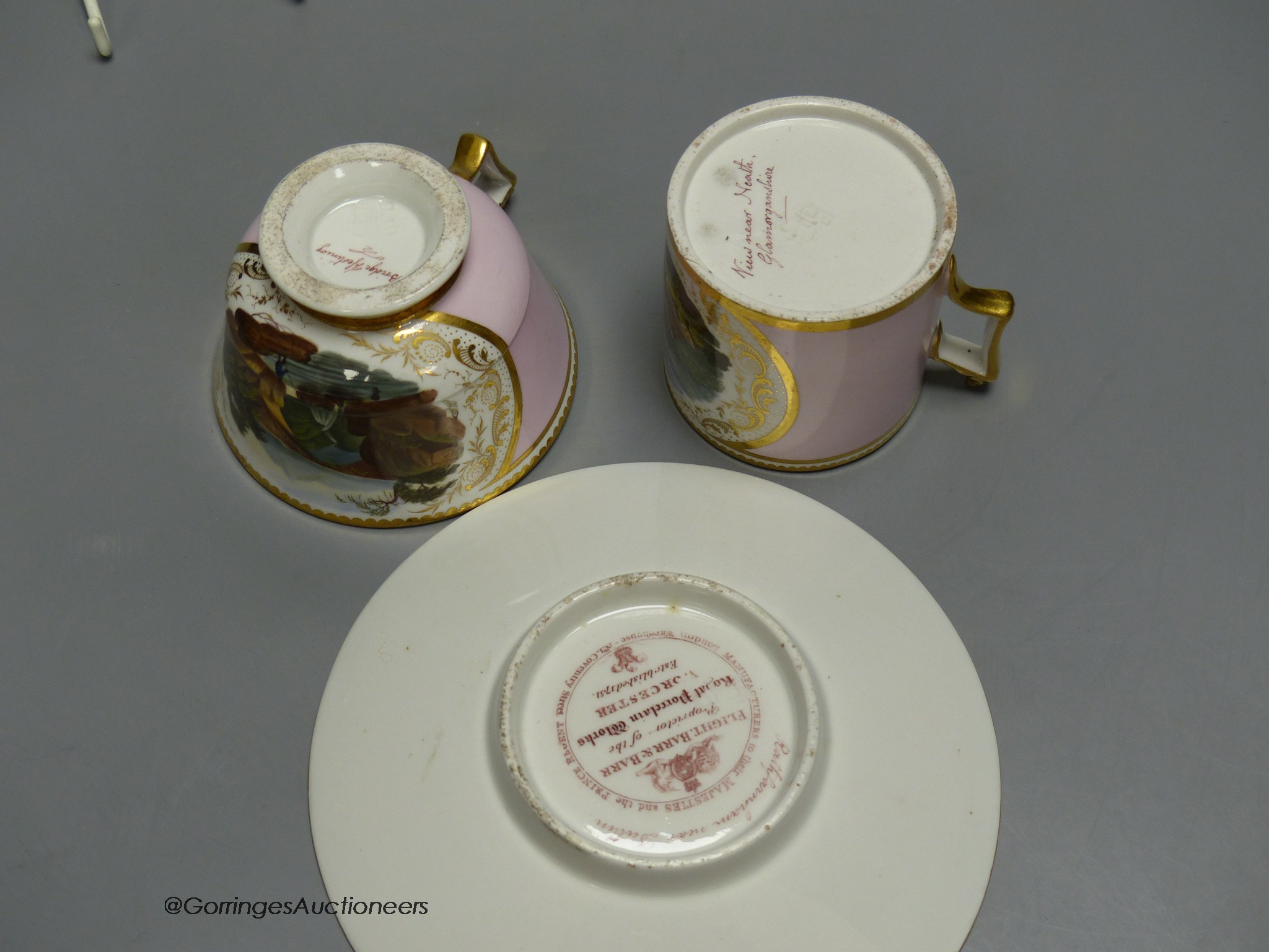 A finest quality Barr Flight and Barr coffee can, teacup and saucer painted with named scenes surrounded by a pink ground, saucer 15cm diameter